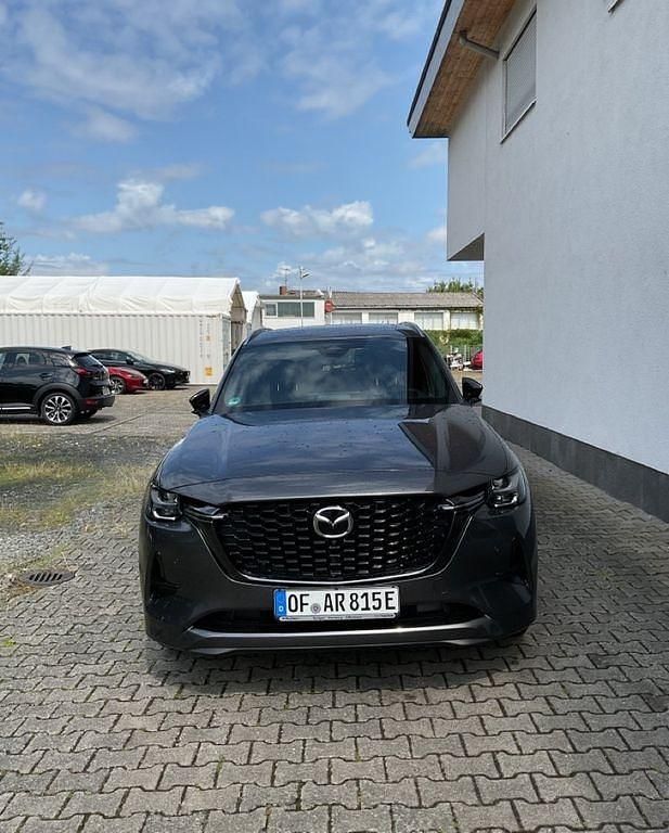 Grau Gebraucht 2025 Mazda CX-80 Homura-Line SUV | 53.769 € (Fairer Preis) - Bild 1/4