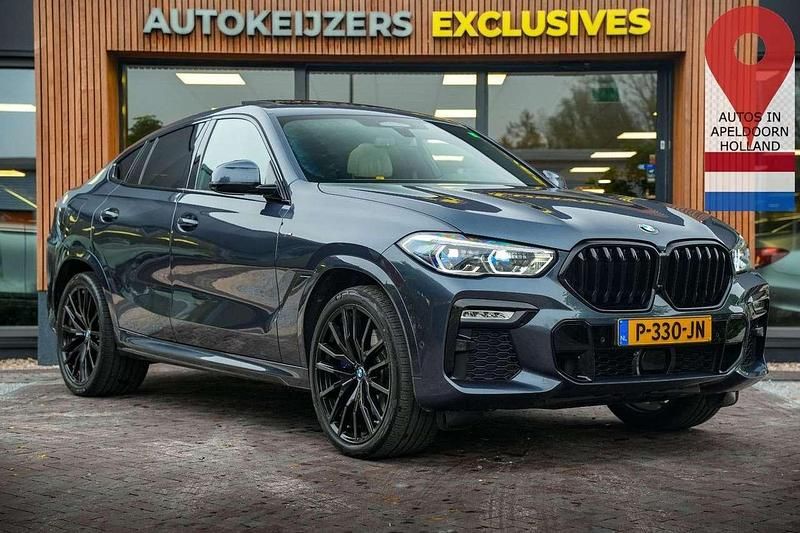 Grau Gebraucht 2021 BMW X6 Executive SUV | 60.499 € - Bild 1/4