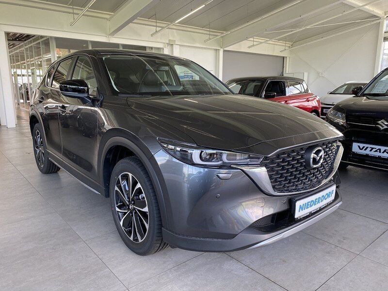 Machine grey (metallic) Gebraucht 2024 Mazda CX-5 Newground SUV | 35.900 € (Fairer Preis) - Bild 1/4