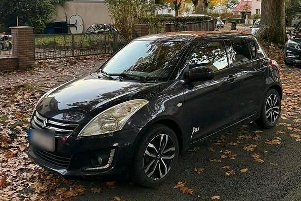 Schwarz Gebraucht 2015 Suzuki Swift X-TRA Kleinwagen | 6.500 € (Fairer Preis) - Bild 1/4