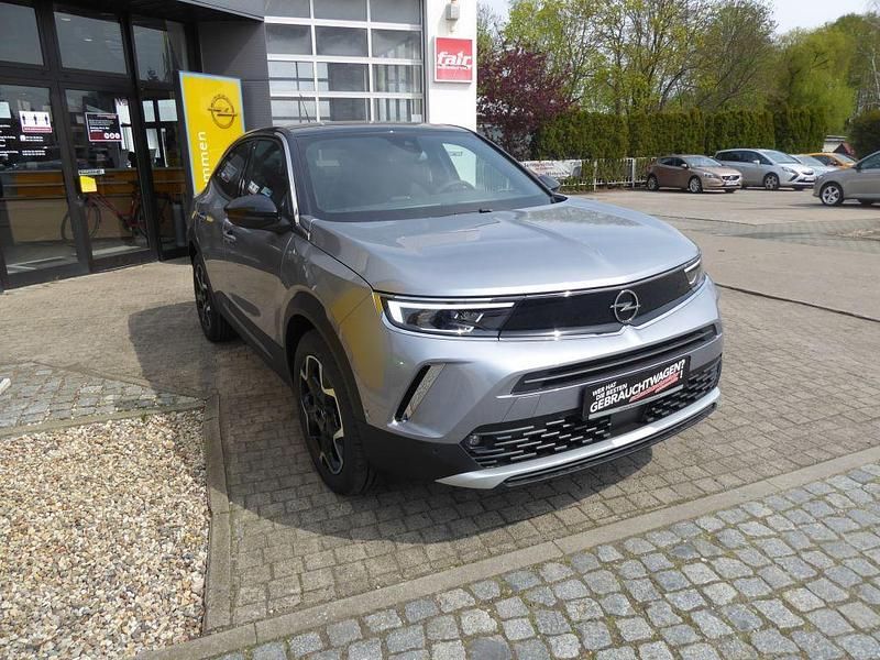 Gebraucht Opel Mokka-e Ultimate 100 kW (136 PS) 2023 Kontrast grau metallic SUV