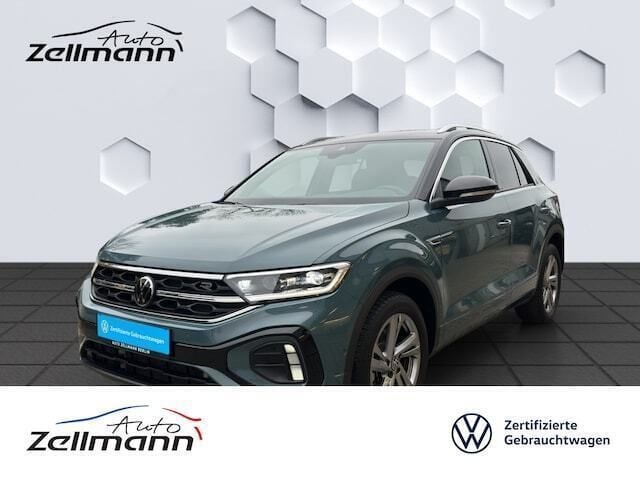 Petroleum blue metallic Gebraucht 2024 VW T-Roc R-line SUV | 30.966 € (Fairer Preis) - Bild 1/2
