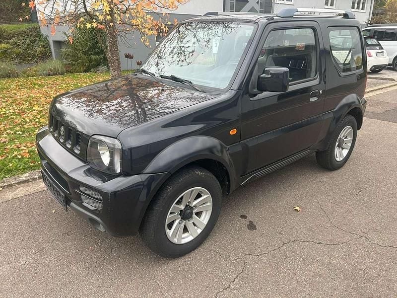 Schwarz Gebraucht 2013 Suzuki Jimny Style SUV | 8.950 € (Superpreis) - Bild 1/4
