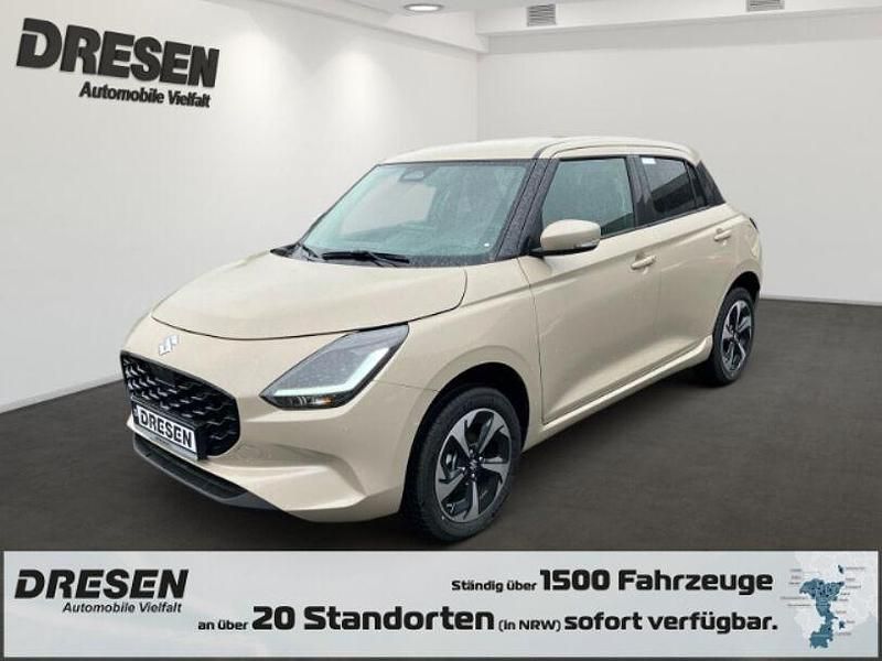 Caravan ivory pearl metallic Gebraucht 2024 Suzuki Swift Comfort+ Limousine | 17.990 € (Fairer Preis) - Bild 1/4
