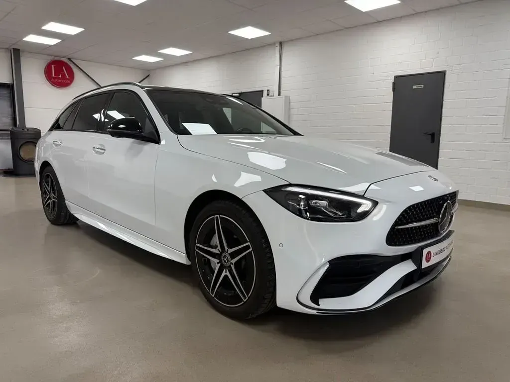 Gebraucht Mercedes C300e AMG line 313 PS (230 kW) 2022 Opalithweiss  metalliclack Kombi