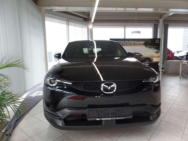 Jet black (metallic) Gebraucht 2023 Mazda MX30 Makoto SUV | 25.740 € (Superpreis) - Bild 1/4