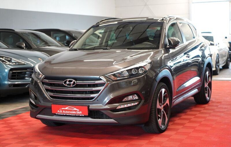 Grau Gebraucht 2018 Hyundai Tucson Premium SUV | 15.950 € (Guter Preis) - Bild 1/4