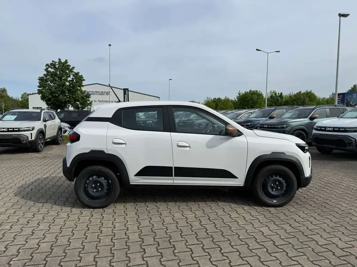 Gebraucht Dacia Spring Extreme 47 kW (65 PS) 2025 Polarweiss Kleinwagen