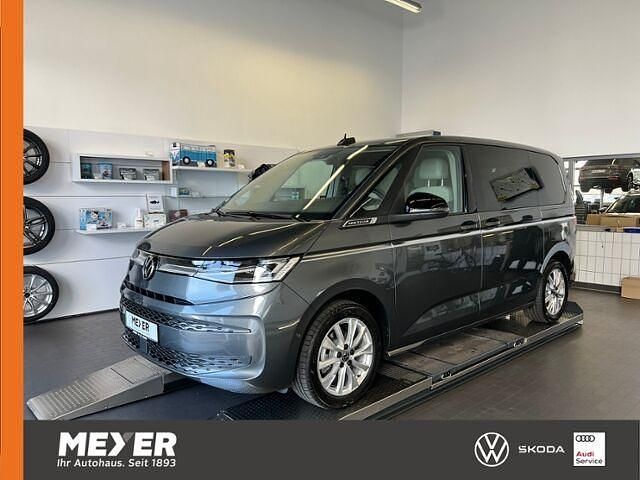 Grau Gebraucht 2024 VW Multivan Style Van | 59.890 € - Bild 1/2