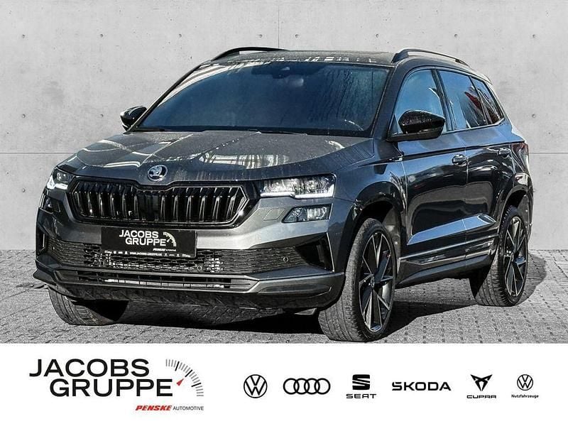 Grau Gebraucht 2024 Skoda Karoq SportLine SUV | 34.380 € (Fairer Preis) - Bild 1/4