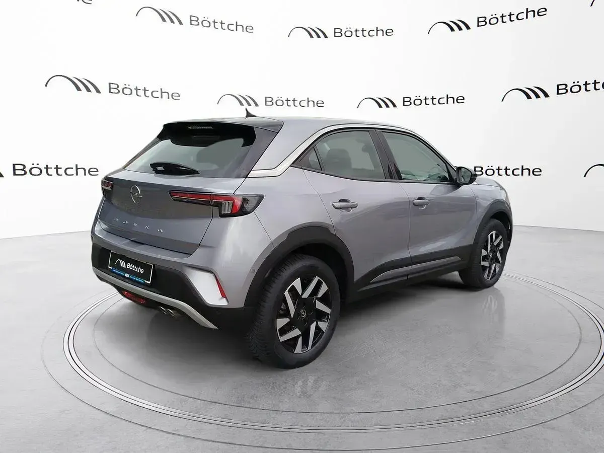 Gebraucht Opel Mokka Elegance 131 PS (96 kW) 2021 Kontrast grau/quarz silber SUV