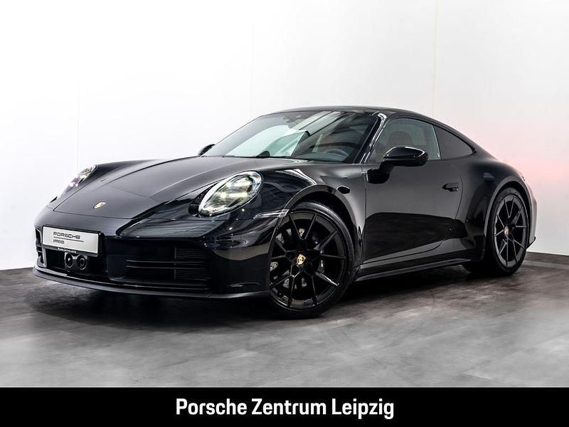 Tiefschwarzmetallic Gebraucht 2024 Porsche 911 Carrera Coupé | 151.800 € (Fairer Preis) - Bild 1/4