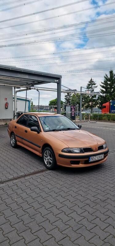 Orange Gebraucht 2003 Mitsubishi Carisma Limousine | 1.300 € - Bild 1/4