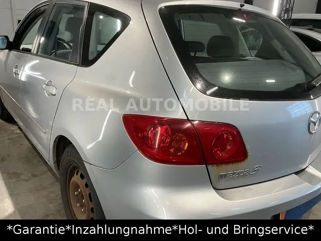 Używany Mazda 3 Comfort 84 KM (61 kW) 2004 Srebrny Sedan/Limuzyna