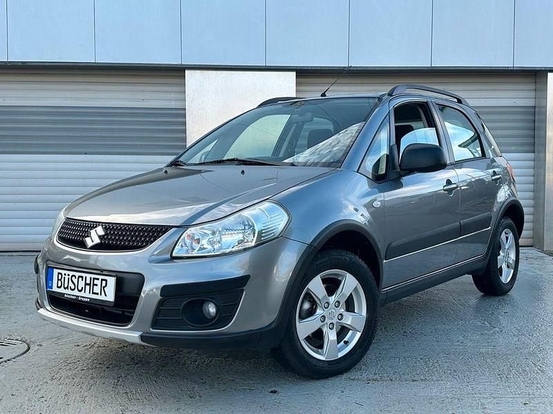 Grau Gebraucht 2012 Suzuki SX4 Limousine | 9.850 € (Teuer) - Bild 1/4