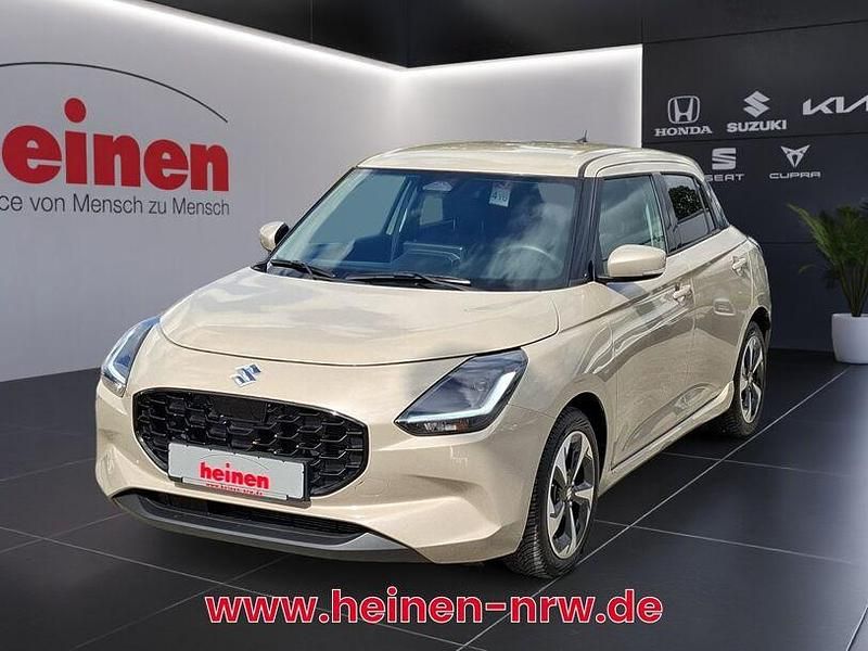 Beige Gebraucht 2025 Suzuki Swift Comfort+ Limousine | 16.999 € - Bild 1/4