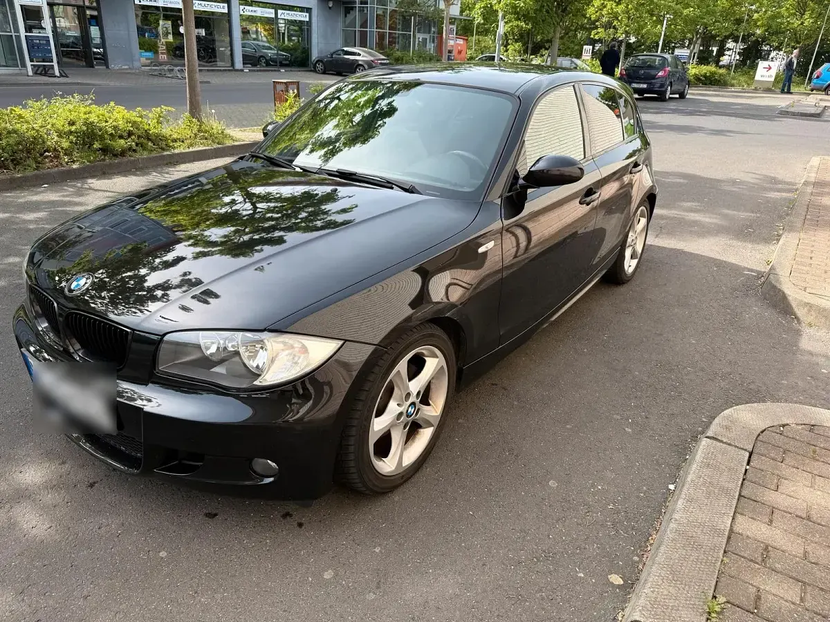 Second-hand BMW 116 122 CP (89 kW) 2010 Negru Hatchback
