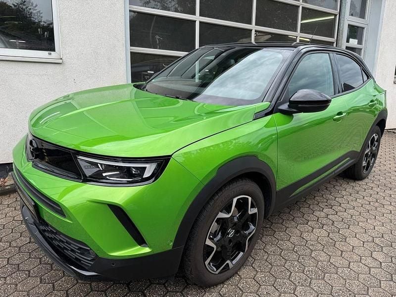 Grün Gebraucht 2024 Opel Mokka-e Ultimate SUV | 30.850 € (Teuer) - Bild 1/4