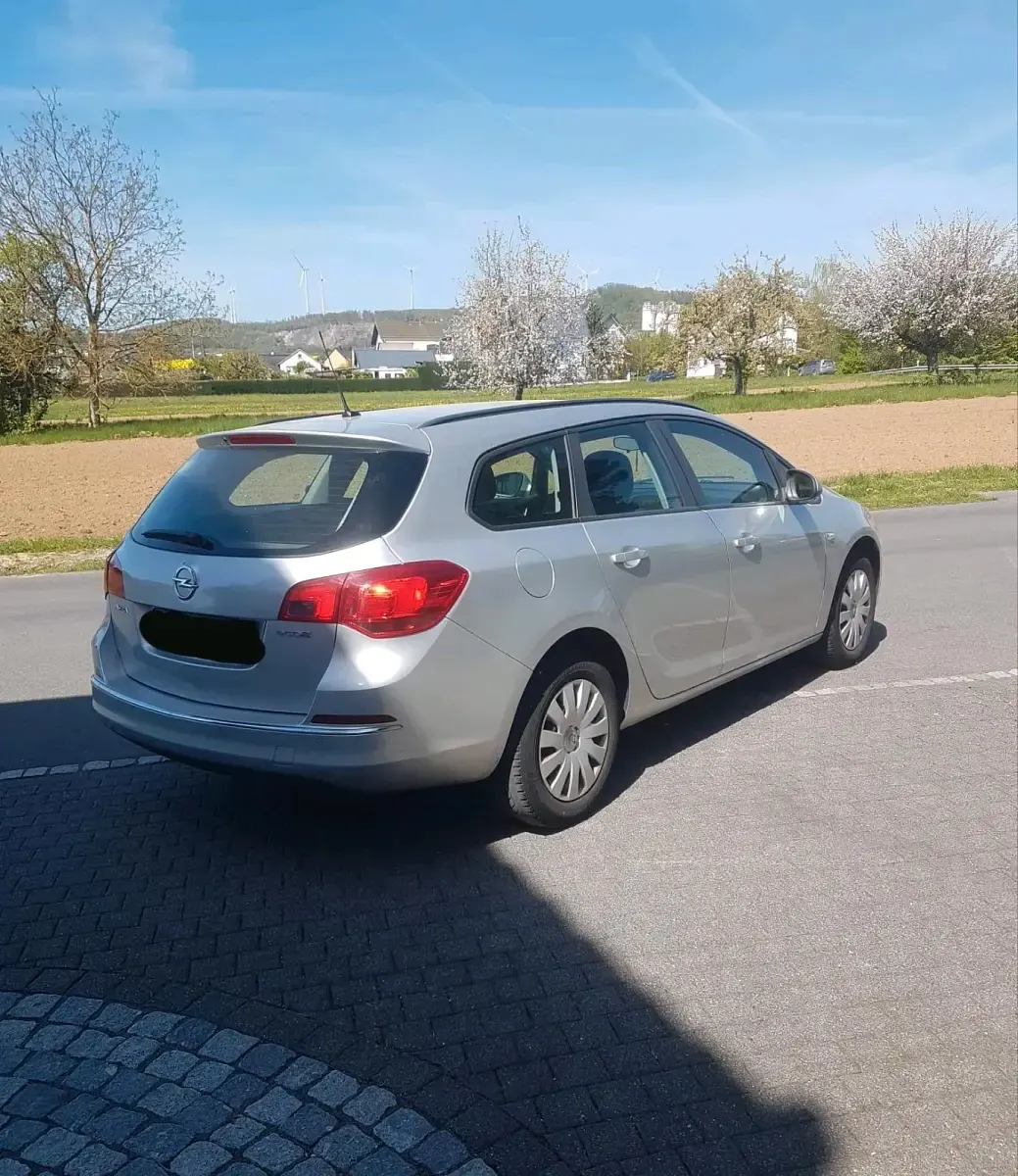 Second-hand Opel Astra 110 CP (80 kW) 2014 Argintiu Break