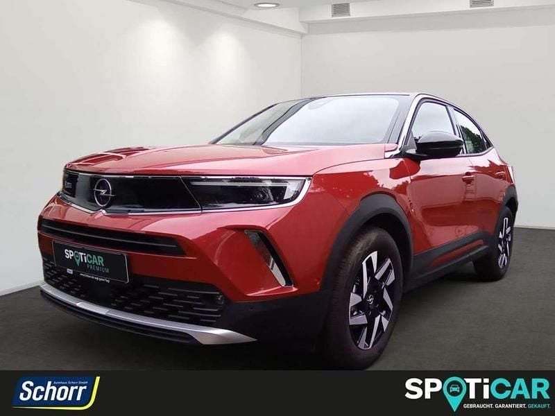 Kosmos rot (metallic) Gebraucht 2023 Opel Mokka-e Elegance SUV | 22.500 € (Fairer Preis) - Bild 1/4