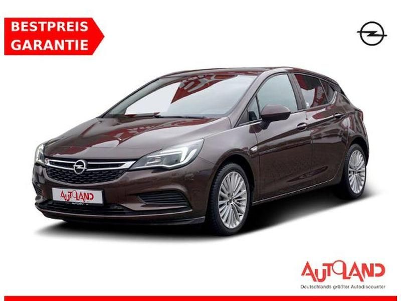 Kokosnussbraunmetallic (metallic) Gebraucht 2016 Opel Astra Limousine | 12.990 € (Etwas zu teuer) - Bild 1/4