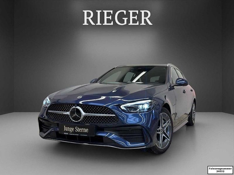 Blau Gebraucht 2024 Mercedes C300e AMG Kombi | 41.839 € (Guter Preis) - Bild 1/4
