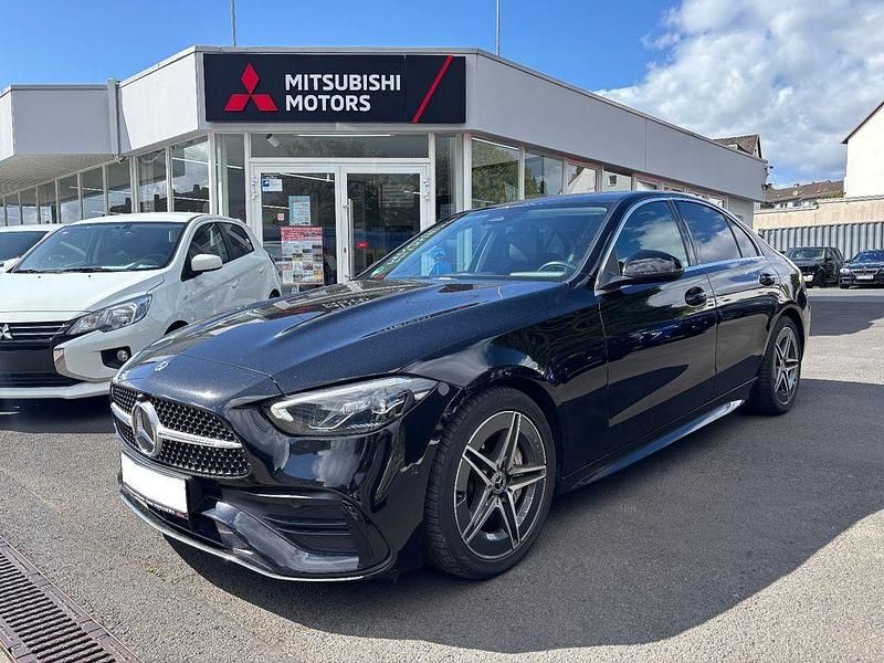 Schwarz Gebraucht 2022 Mercedes C180 AMG line Limousine | 35.990 € - Bild 1/4