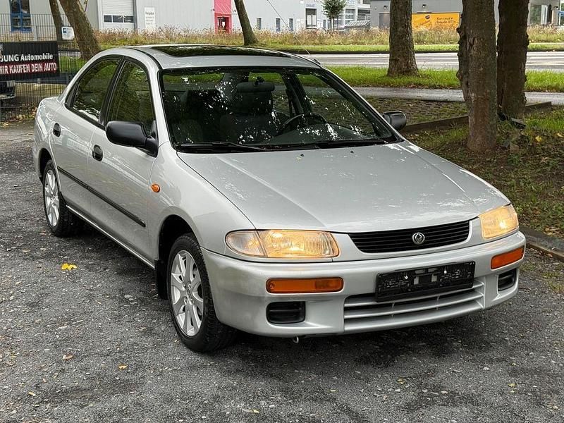 Silber Gebraucht 1996 Mazda 323 Limousine | 2.999 € - Bild 1/4