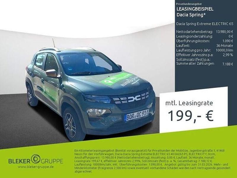 Oliv grau Gebraucht 2023 Dacia Spring Extreme Kleinwagen | 13.980 € (Fairer Preis) - Bild 1/3