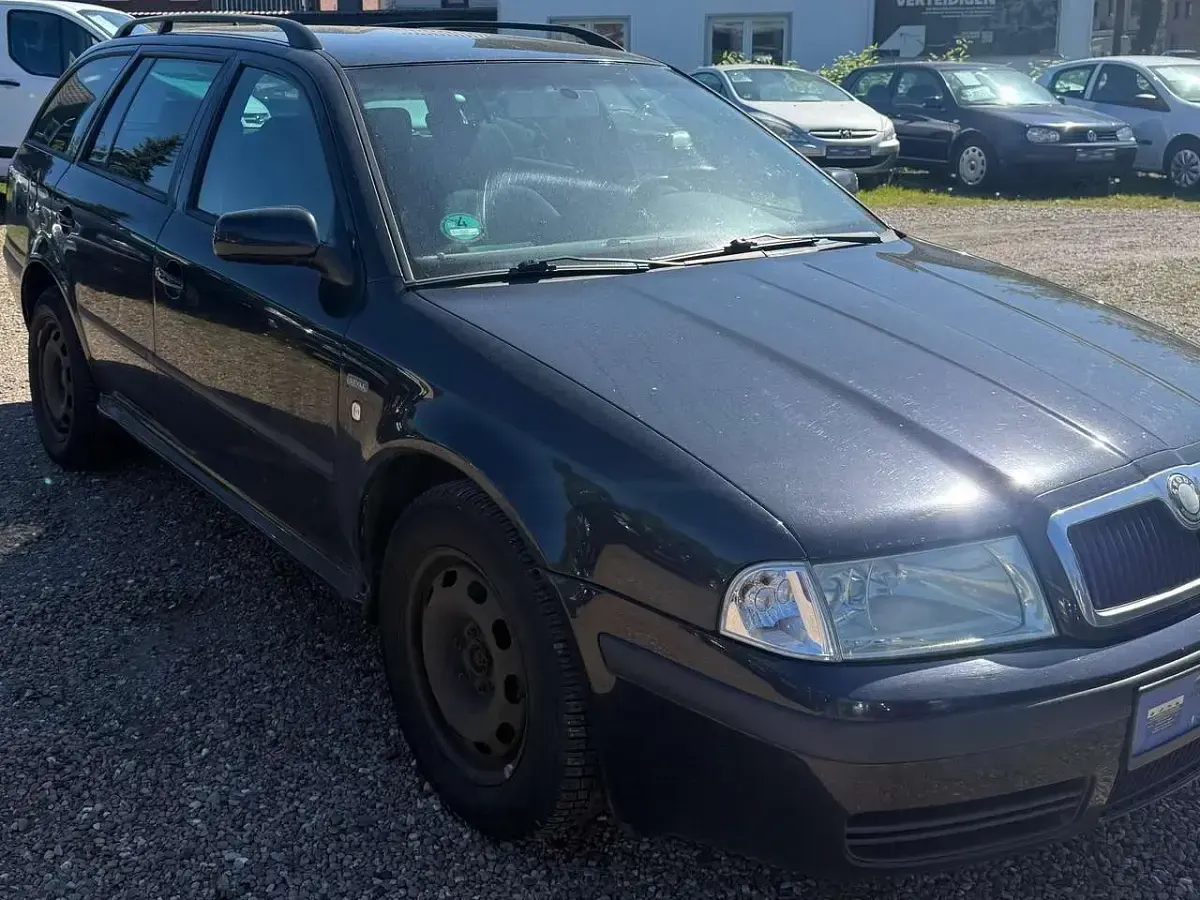 Używany Skoda Octavia Style 110 KM (80 kW) 2004 Czarny Kombi