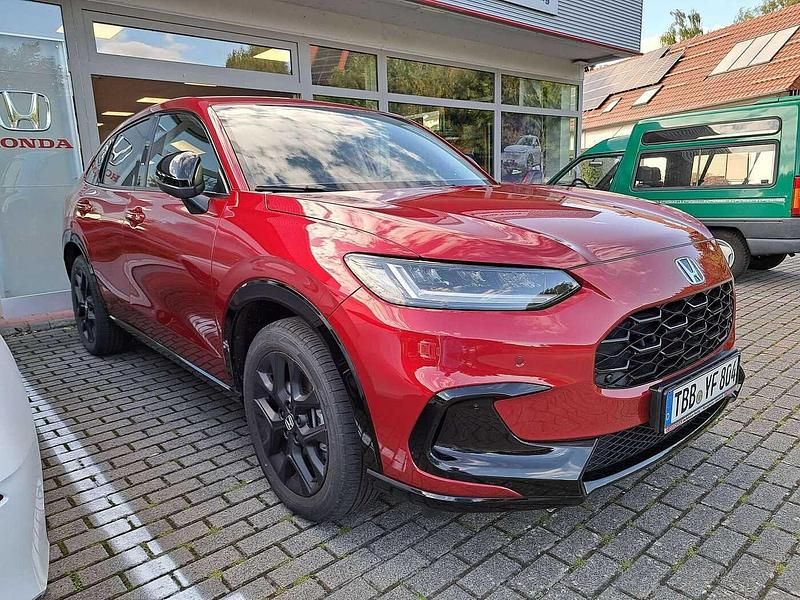 Radiant red metallic Gebraucht 2024 Honda ZR-V Hybrid SUV | 41.990 € - Bild 1/4