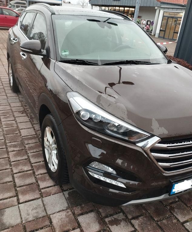 Braun Gebraucht 2017 Hyundai Tucson Premium SUV | 14.900 € (Fairer Preis) - Bild 1/4