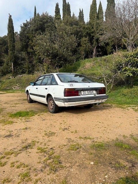Second-hand Mazda 626 63 CP (46 kW) 1987 Alb Berlinǎ