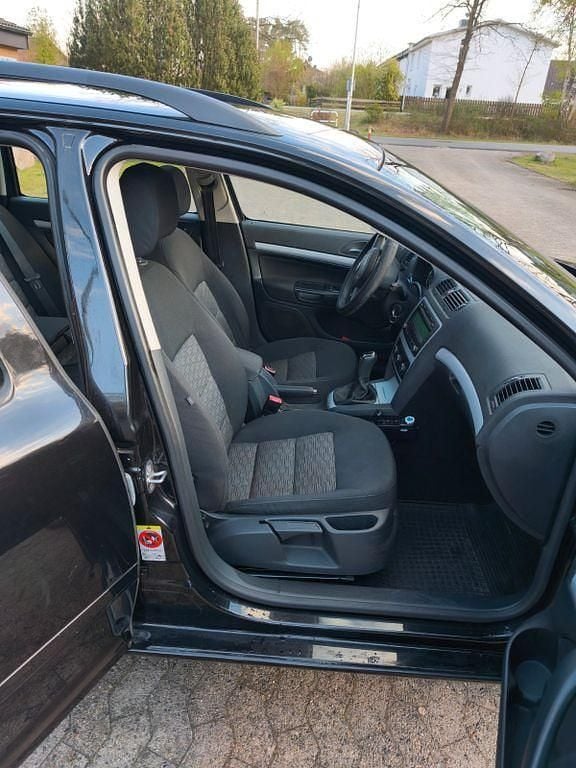 Second-hand Skoda Octavia Impuls Edition 105 CP (77 kW) 2011 Negru Break