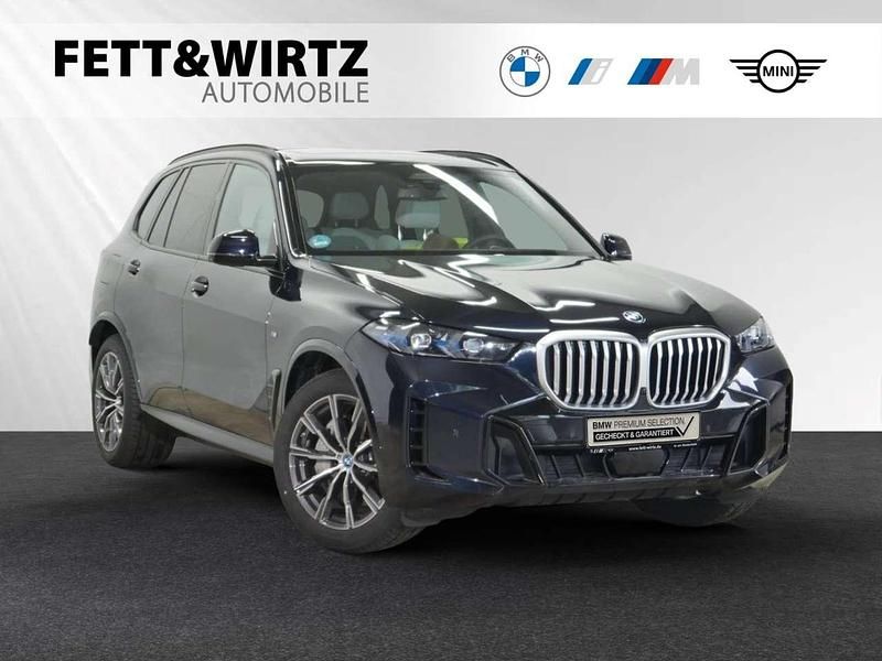 Carbonschwarz metallic Gebraucht 2024 BMW X5 M Sport SUV | 87.888 € (Guter Preis) - Bild 1/3