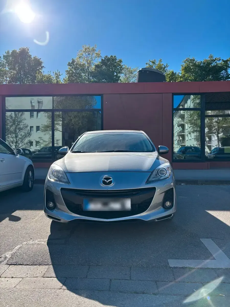 Second-hand Mazda 3 105 CP (77 kW) 2012 Argintiu Berlinǎ