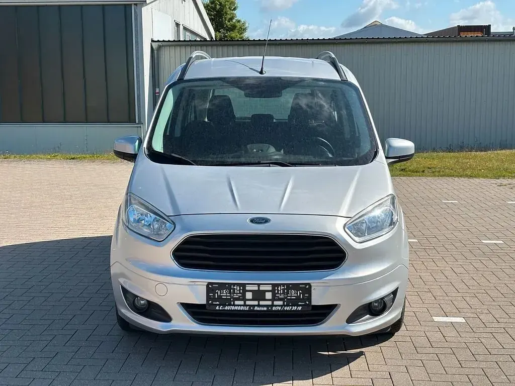 Gebraucht Ford Tourneo Courier Trend 76 PS (55 kW) 2015 Silber Van / Kleinbus