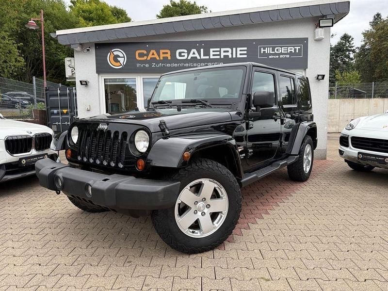 Schwarz Gebraucht 2012 Jeep Wrangler Unlimited Sahara SUV | 25.990 € (Superpreis) - Bild 1/4