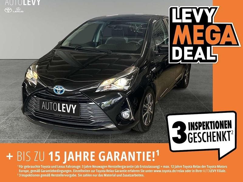 Black mica / ink Gebraucht 2019 Toyota Yaris Hybrid Club Kleinwagen | 13.270 € - Bild 1/4