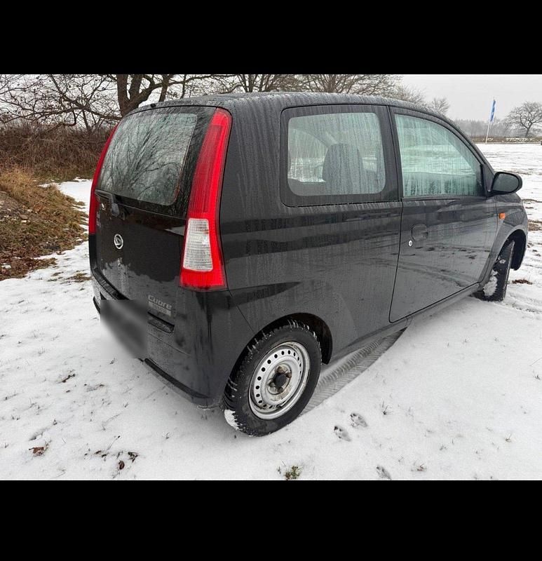 Gebraucht Daihatsu Cuore 59 PS (43 kW) 2006 Schwarz Kleinwagen