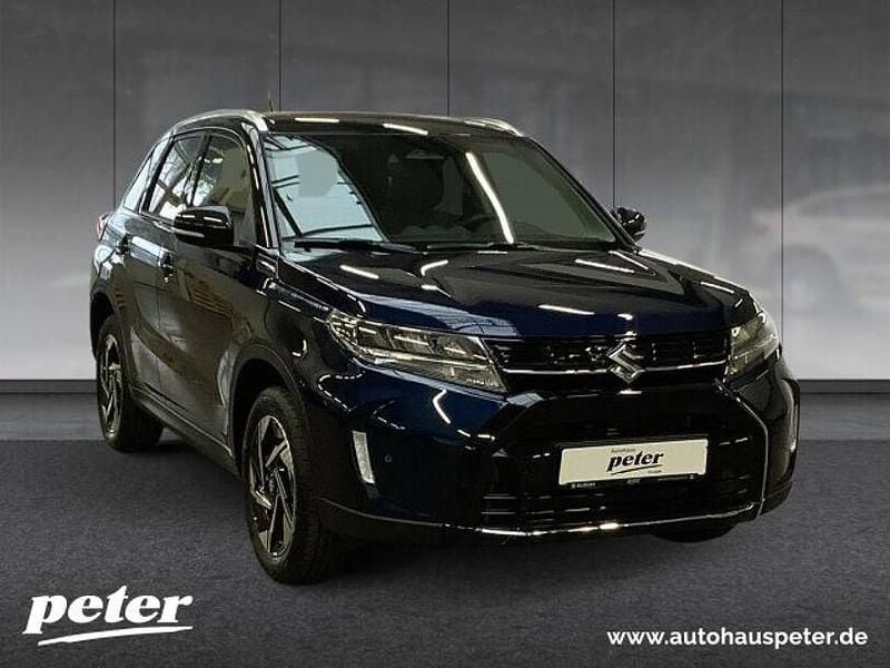 Gebraucht Suzuki Vitara Comfort 102 PS (75 kW) 2025 Sphere blue/ cosmic black pearl SUV