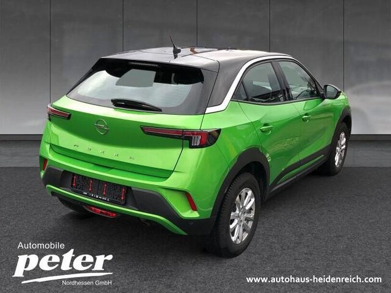 Gebraucht Opel Mokka Enjoy 101 PS (74 kW) 2024 Lackierung matcha green/typ aussenverkle (metallic) SUV