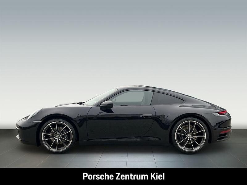 Gebraucht Porsche 911 Carrera 385 PS (283 kW) 2021 Tiefschwarzmetallic Coupé