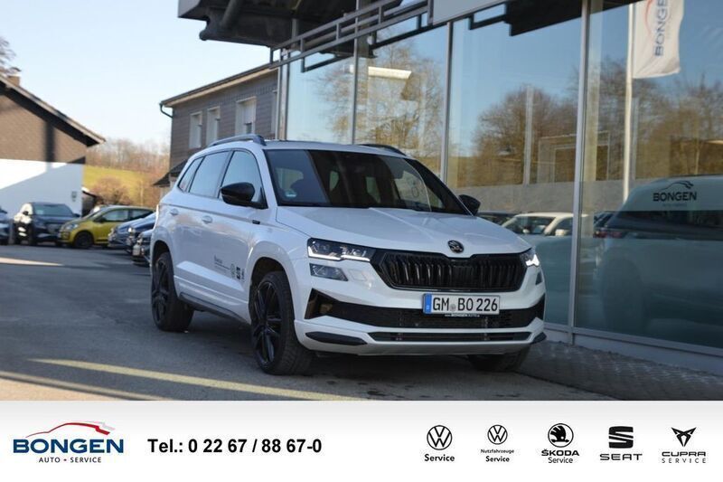 Weiß Gebraucht 2024 Skoda Karoq SportLine SUV | 36.990 € (Teuer) - Bild 1/4