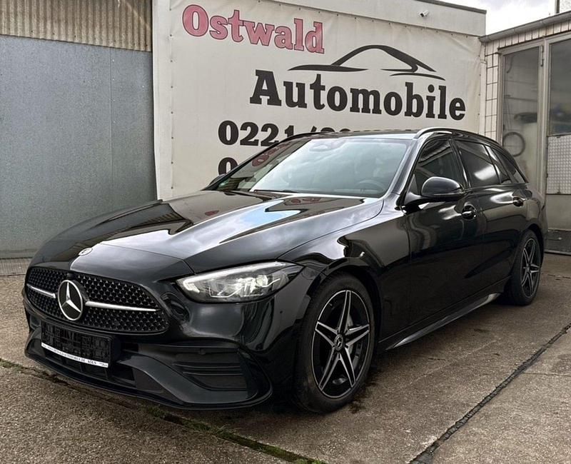 Schwarz Gebraucht 2023 Mercedes C220 AMG line Kombi | 29.390 € - Bild 1/4