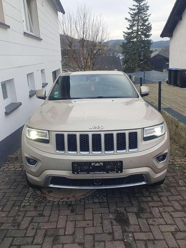 Gold Gebraucht 2013 Jeep Grand Cherokee Overland SUV | 13.999 € (Teuer) - Bild 1/4