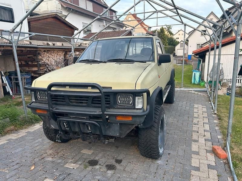 Braun Gebraucht 1991 Nissan PickUp Abholung | 3.999 € - Bild 1/4