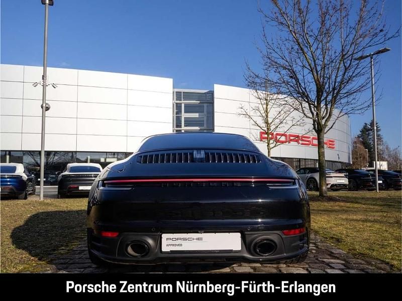Gebraucht Porsche 992 385 PS (283 kW) 2023 Tiefschwarzmetallic Coupé