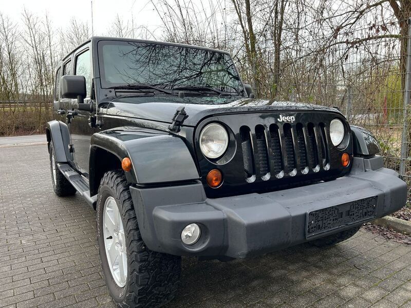 Schwarz Gebraucht 2012 Jeep Wrangler Unlimited Sahara SUV | 18.990 € (Fairer Preis) - Bild 1/4