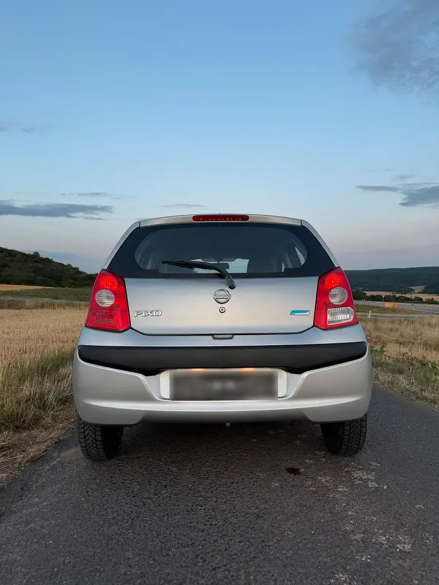 Gebraucht Nissan Pixo Pure 68 PS (50 kW) 2010 Grau Kleinwagen